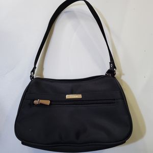 Black Fabric So Collection Handbag.  Zip Closure. 4 Pockets of Different Sizes